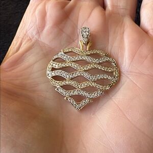 10kt Two Tone (white & yellow) Gold Heart Wave Pendant
The Sparkle is Beautiful